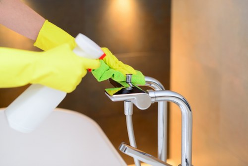 Carpet cleaning technician preparing equipment in a safe, insured service environment